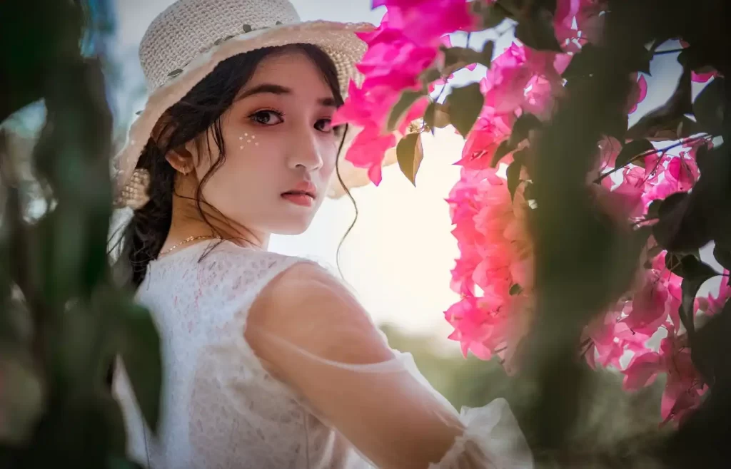 Woman wearing sun hat. - Glow Up For Summer