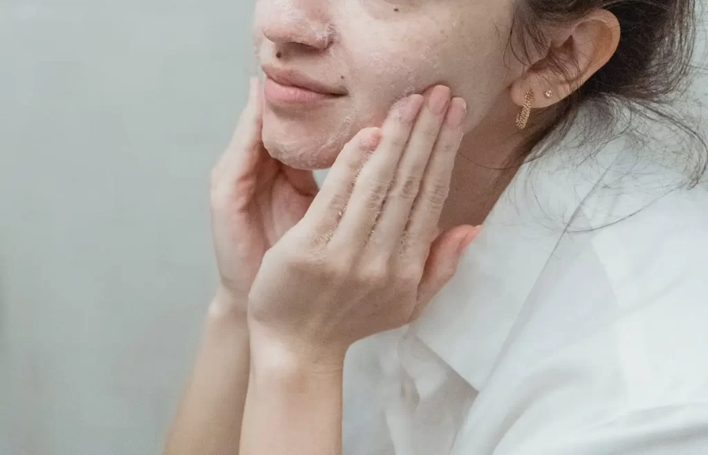 Woman washing face - Top 10 Skin Care Tips For Summer