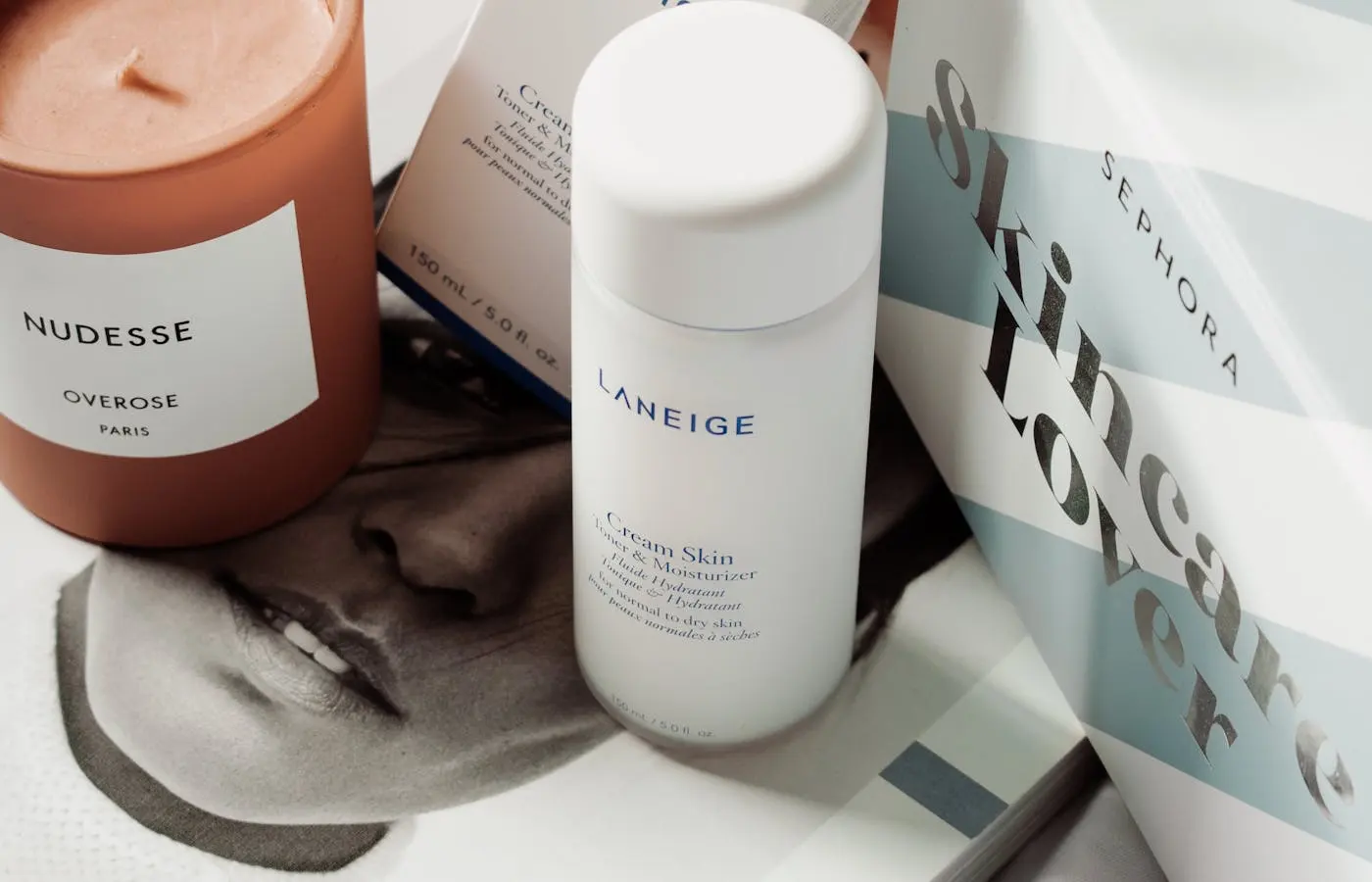 Photo of Laneige Cream Skin and a candle. - Best Milky toners